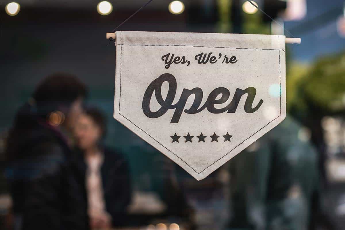 An open sign on the door of a small business