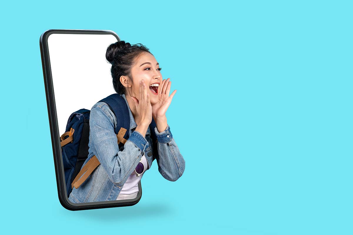 Excited woman yelling joyfully from a giant smartphone screen, symbolizing mobile marketing.