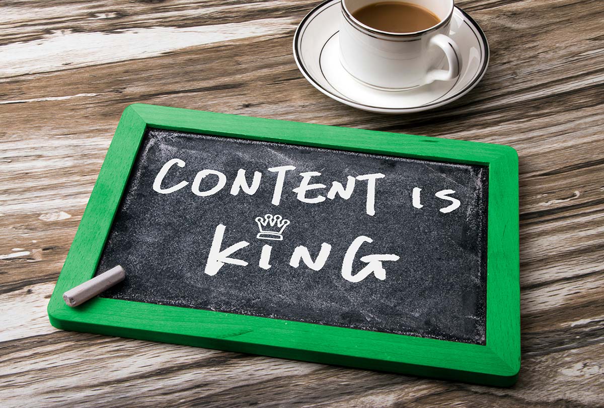 Chalkboard with "Content is King" written on it, representing the importance of content in small business marketing strategies.