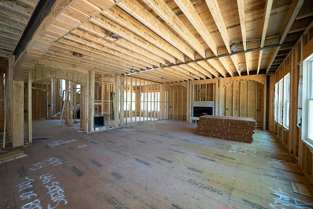 Residential home interior under construction, showing framing stage of a building project, representing a trade in the home services